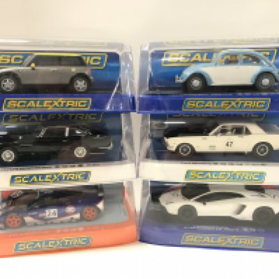 6 Boxed Scalextric Cars. A Mini Cooper. A Volkswagen Beetle. A Aston Martin DB5. A Ford Mustang. A McLaren F1 GTR And a Lamborghini Adventador LP 700-4.