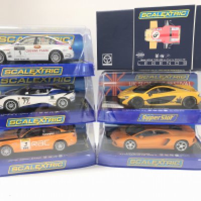 6 Boxed Scalextric Cars including BMW 320SI WTCC. A Lotus Evora GT4. A BMW 320SI BTCC. A McLaren P1(Limited Edition). A Lamborghini Aventador LP 700-4 And A Legends Team Lotus Type 49B.