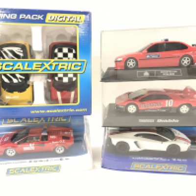 4 Boxed Scalextric cars and a Racing Pack. A Lamborghini Countach. A Lamborghini Aventador LP 700-4. And Others.