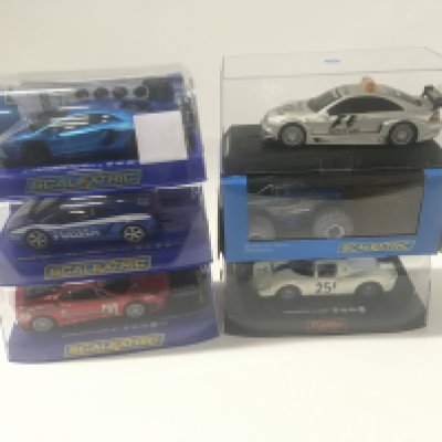 A collection of 6 Scalextric cars in original display boxes. Includes C2918 a Ferrari 412P. C3835 Monster Truck. Mercedes F1 safety car. C3264 Lamborghini Aventador LP 700. C2876 Lamborghini Gallardo polizia. C3012 Ferrari F430 GT2