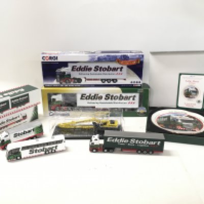A collection of boxed and loose diecast models vehicles all marked Eddie Stobart. Manufacturers include Atlas..Oxford..Corgi etc. also includes a commerative plate . No reserve