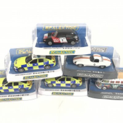 6 boxed Scalextric to include 3 Police BMW 330 M.SPORT. Jaguar Etype. Volkswagen camper van. Volkswagen Golf GTI. no reserve.