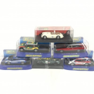 6 boxed Scalextric cars. To include Ferrari F430. Aston Martin DB9. Lamborghini Gallardo. Mini Cooper s. Dodge Charger. Austin Healey. No reserve.