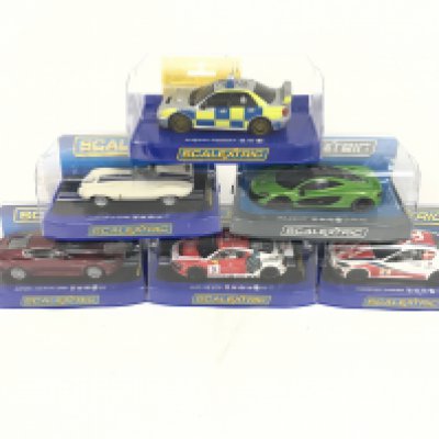 6 boxed Scalextric cars. To include Maserati Trofeo. Audi R8. Aston Martin DBS. Jaguar D-type. McLaren P1. Subaru Impreza. No reserve.