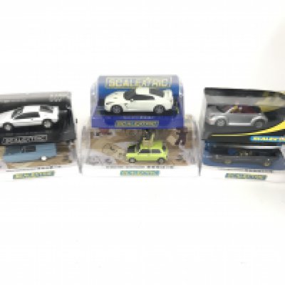 6 boxed Scalextric cars to include Mr Bean Mini. Mr Bean Reliant Supervan.Nissan GTR. Lotus Esprit. VW beetle. No reserve.