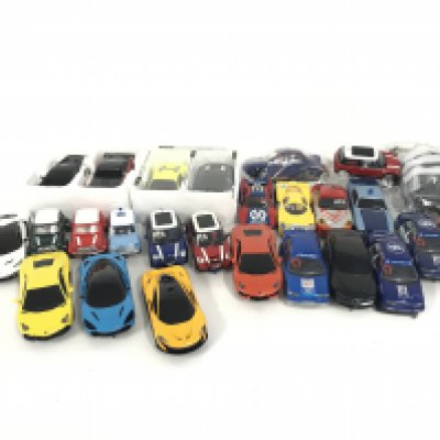 A box containing a collection of used Scalextric cars and accessories. No reserve.