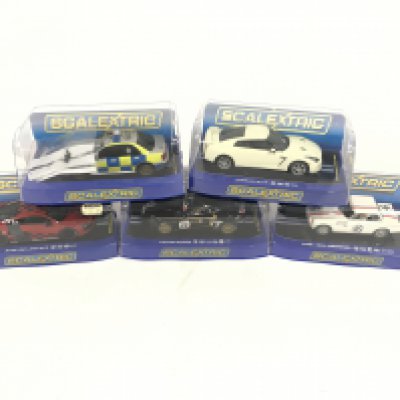 5 boxed Scalextric cars. To include Nissan GTR. MGB Sebring. lotus Evora. Audi R8. Police Subaru. No reserve.