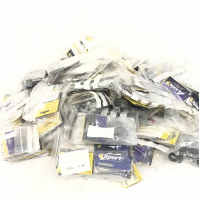 A box containing a large quantity of spare Scalextric parts. Mostly bagged and new. No reserve.
