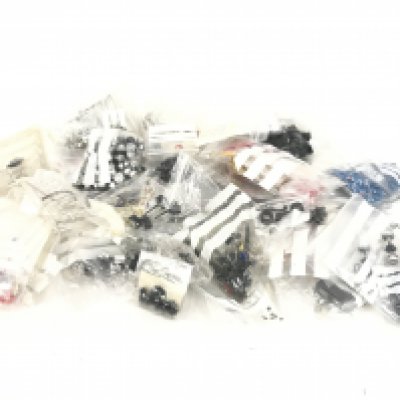 A box containing a large quantity of spare parts for Scalextric cars. No reserve.