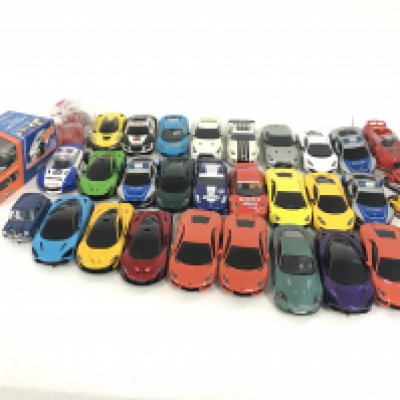 A box containing a quantity of used Scalextric cars. Also to include a quantity of spare parts. Many new. No reserve.