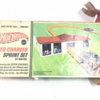 A Boxed Hot Wheels Super-Charger Sprint Set. Box Is Worn. Parts Missing No Reserve.