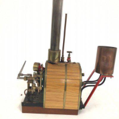 A bespoke static model steam engine mounted on a wooden base.