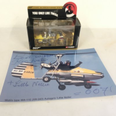 A boxed model helicopter called Little Nellie from the 007 film YOU ONLY LIVE TWICE. Lot includes a signed picture of the Autogyro being flown by its designer Wing commander Kenneth Horatio Wallis DSO MBE who piloted it during the making of the film.