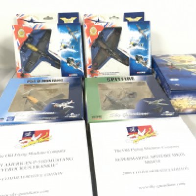 A collection of 5 military model aircraft in the original display packaging by Corgi and Witty Wings. Of note in this lot the 2006 commemorative Spitfire has been signed .