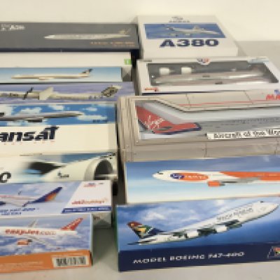 A collection of model civil aircraft representing airlines from all over the world all are boxed and require assembly.