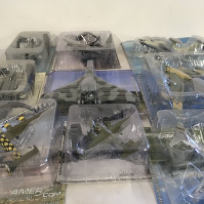 A collection of approximately 20 model aircraft all unopened in original packaging.