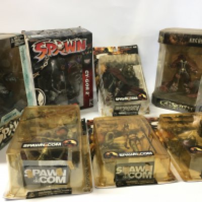 A collection of 8 boxed SPAWN action figures.