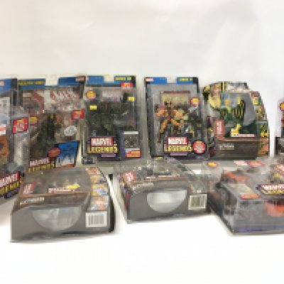 A collection of 11 Marvel Legends action figures all unopened in the original display packaging.