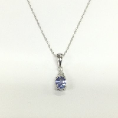 A 9ct white gold pendant set with small diamonds and tanzanite, approx 1g. Shipping category A.