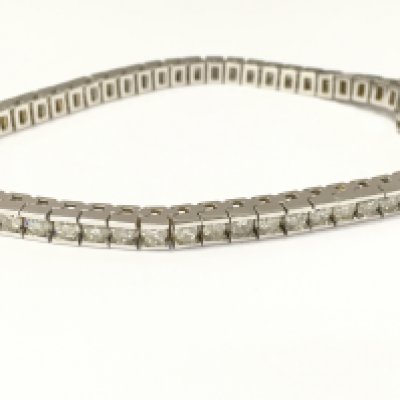 A 14ct white gold diamond line bracelet. Approximately 4.85ct diamonds total. Postage B