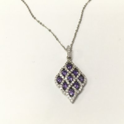 A silver pendant set with purple and white cubic zirconia on a silver chain. Postage A