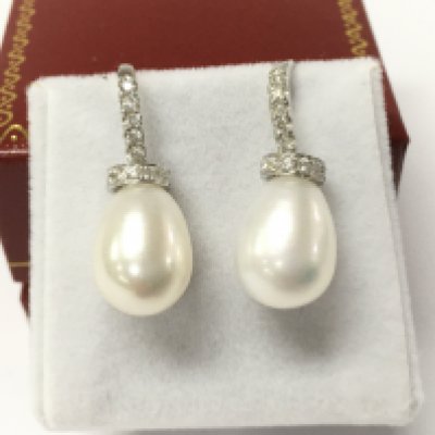 A pair of 18ct white gold bell shaped cultured pearl earrings set with diamonds in the bales and collars with fish hook backs, diamonds approximately 0.40ct.
