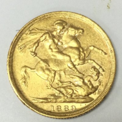 A 1889 full sovereign. Postage A