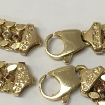 14 carat gold ruby and diamond set necklace and matching bracelet , 34g total weight approximately. Postage category A