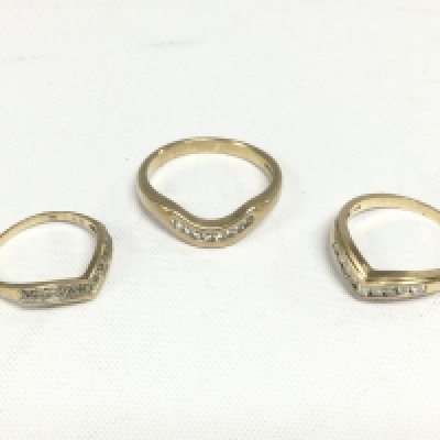 Three 9ct gold diamond wishbone rings, total approx 6.8g and approx sizes S, N and J. Shipping category A.