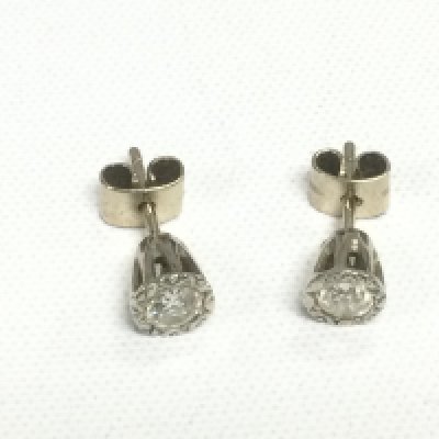 A pair of diamond earrings. Shipping category A.