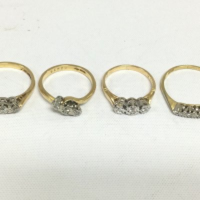Four 18ct gold three stone diamond rings, approx total weight 10.4g and approx sizes K,L,N and P. Shipping category A.
