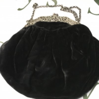 A vintage black velvet and silver evening bag . Postage category B