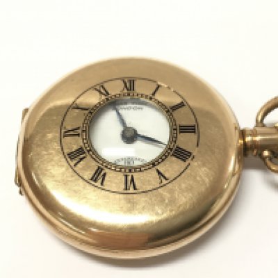 A gold plated pocket watch by Chas Fish London, seen working. Postage category A