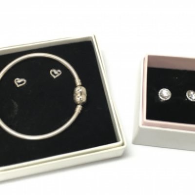 Boxed silver Pandora jewellery including earrings and a bracelet. Postage category B