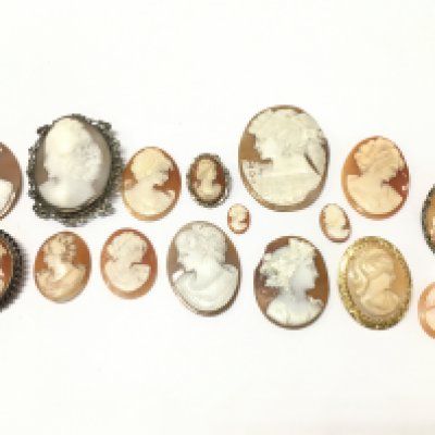A collection of cameos, some silver / yellow metal mounted