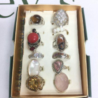 Eleven stone set silver rings. Shipping category B.