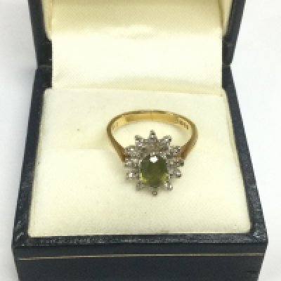 An 18ct gold ring set with green tourmaline, approx 4g and approx size J. Shipping category A.