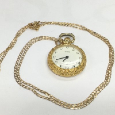 A fob watch suspended on a 9ct gold chain. Shipping cateory A.