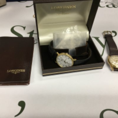 A modern gents longines watch with a gents ingersoll.