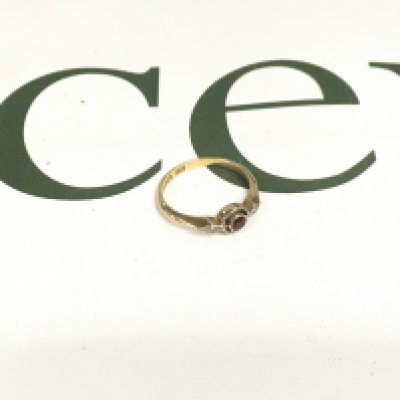 An 18ct ruby and diamond ring. Approx weight 2.08 grams, approx size K.