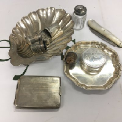 A mixed assortment of silver items.