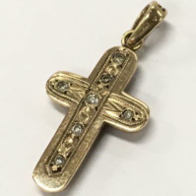 A gold pendant set with rubies and diamonds . 3.5g total weight. Postage category A