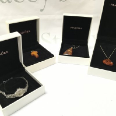 Three ladies amber pendants on silver chains and a ladies rotary watch, marquisette seen working