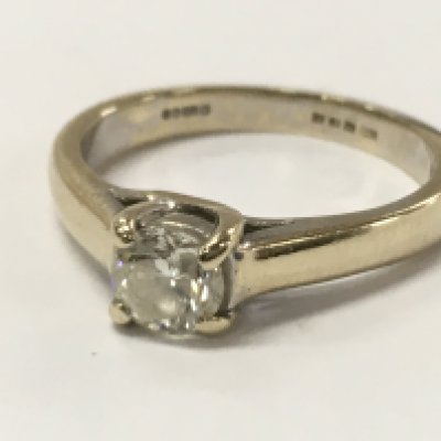 An 18ct gold diamond ring , size L/M. 3.7g total weight. Postage catA