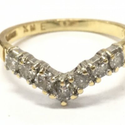 An 18ct gold diamond wishbone ring size N/O 2.9g total weight 2.9g. Postage category A