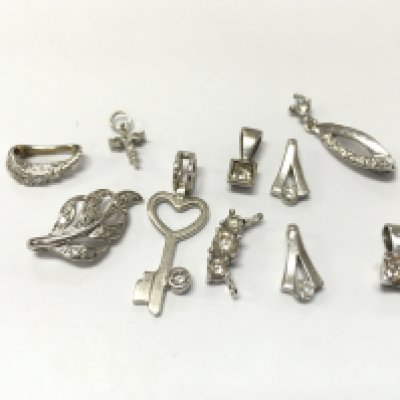 9ct white gold assorted diamond pendants , 8.7g total weight. Postage category A