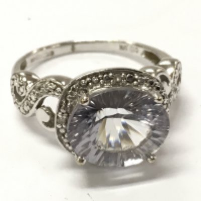 A 9ct white gold Lilac stone ring , size R , 5.2g total weight. Postage category A
