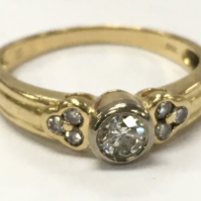 18ct gold diamond solitaire ring with diamond shoulders , 2.5g total weight. Postage category A
