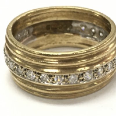 A 9ct gold diamond band ring, size N. 5.3g total weight. postage cat a