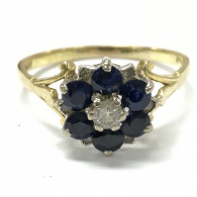 An 18ct gold sapphire/ diamond cluster ring , 3.9g total weight . Postage category A